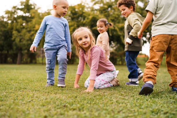 istock Happy children playing on a meadow 2178338199