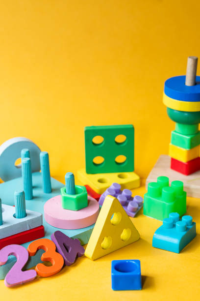istock Colorful Children Building Blocks on Yellow Background 2178338542