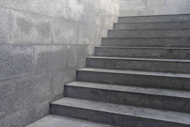 istock A gray staircase with a gray wall behind it 2178339045