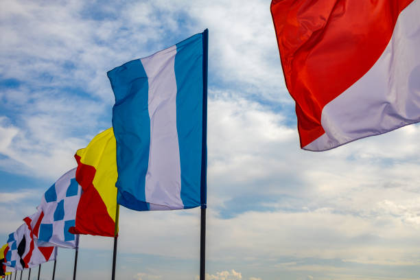 Fishing floats with yellow flags. Equipment for sea fishing on the seashore on a sunny day.