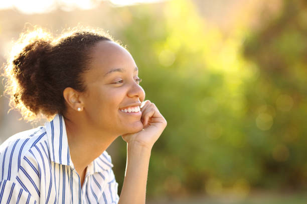 istock Happy black woman relaxing in a garden 2178342002