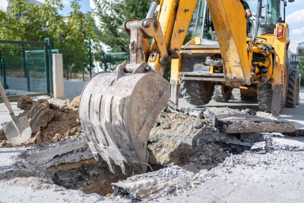 istock Excavator Digging Asphalt On The City Street 2178343752
