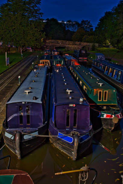 istock Narrow boats moored together on Llangollen canal in twilight, Froncysyllte, Wrexham County Borough, Wales, Britain 2178347340