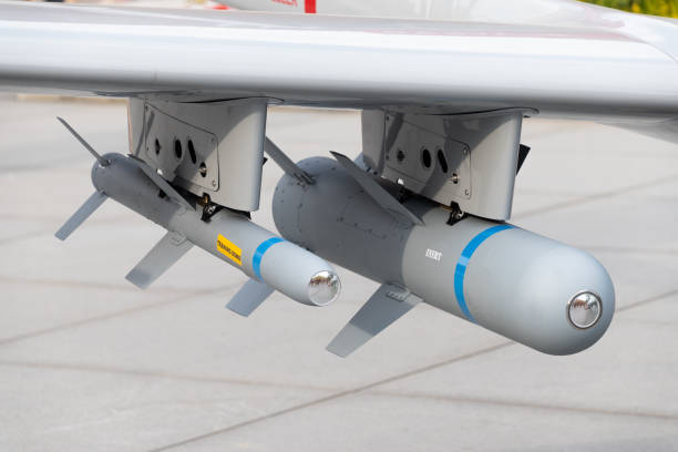 istock A medium-altitude long-endurance unmanned combat aerial vehicle. Two missiles, close-up. 2178347464