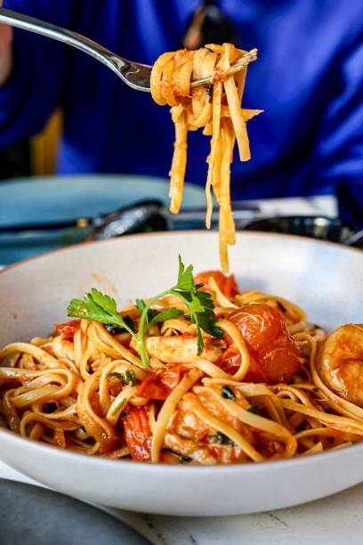 Forkful of Shrimp Linguine Pasta with Tomatoes