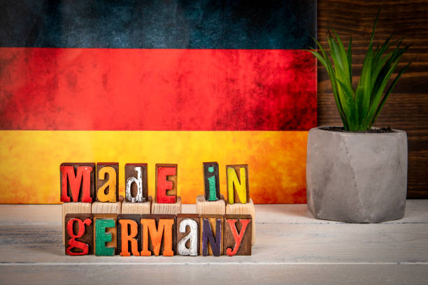 istock Made in Germany. Alphabet blocks on a white painted wooden background 2178352213