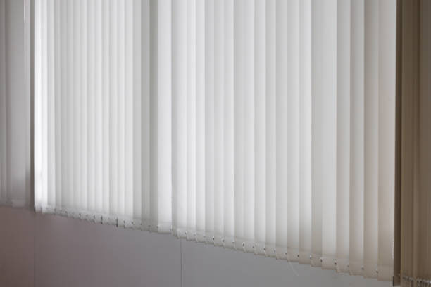 istock A white curtain with white stripes is hanging in a room 2178352462