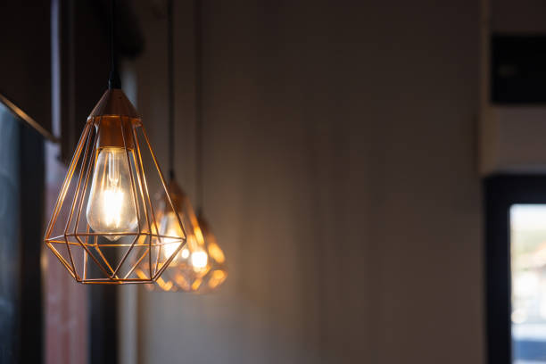 istock A row of three light fixtures with a diamond shaped base 2178352625