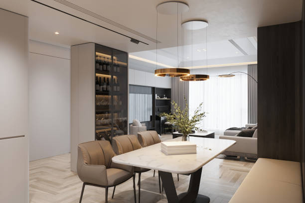 istock Elegant Dining Area with Marble Table, Modern Lighting, and Built-In Wine Cabinet 2178352807