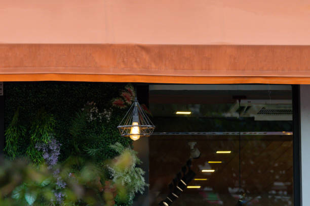 istock A lighted lamp hangs from the ceiling of a restaurant 2178352828