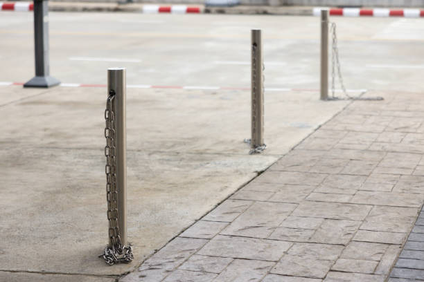 istock A chain is attached to a metal pole on the sidewalk 2178353296