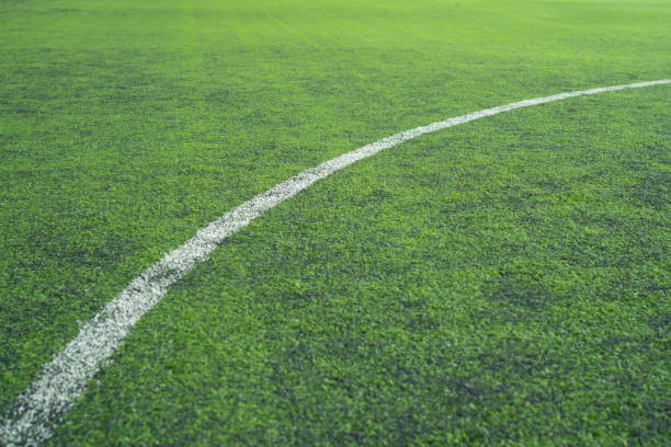 istock A white line is drawn on a green field 2178353609