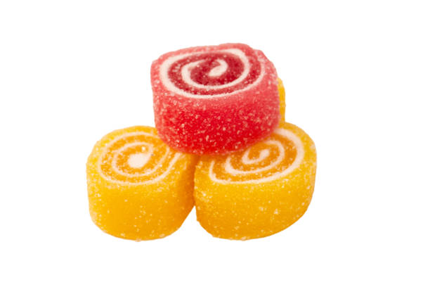 Jelly sweet candy roll isolated on a white background. Marmalade candy.