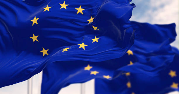 istock European Union flags waving in the wind on a clear day 2178354519