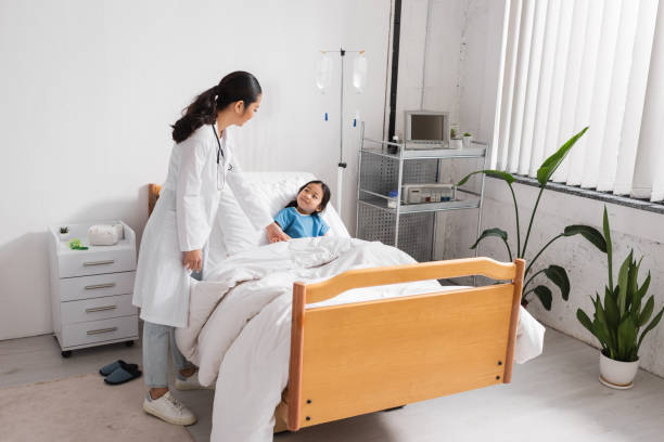 istock A caring pediatrician with her young patient in a cozy clinic during a checkup 2178355371
