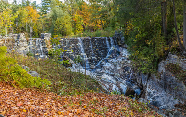 Hudson Brook flows over the marble dam located in Natural Bridge State Park in North Adams, Massachusetts on a fall day
