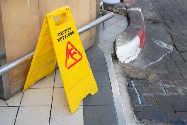 istock A yellow caution sign is on the ground 2178359008