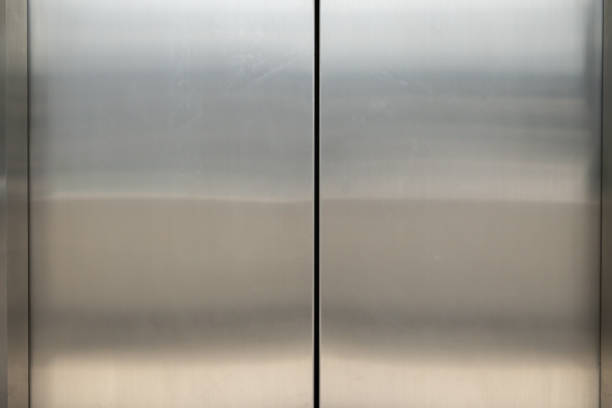 istock The silver doors of an elevator are closed. 2178359052