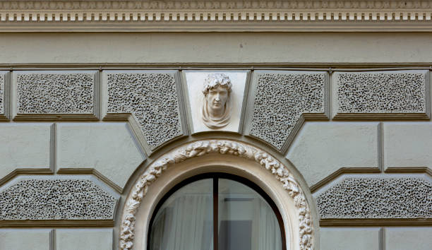 istock tiny male bust in the arch of the window 2178360545