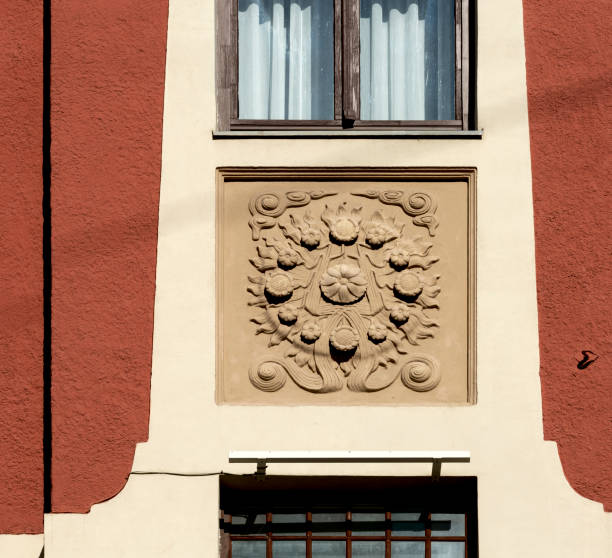 istock floral wheel framed on the red facade 2178363425