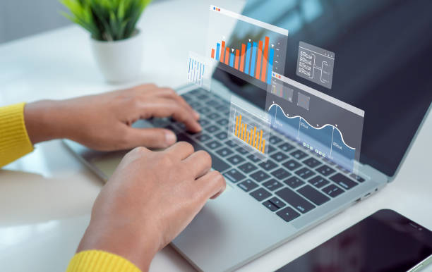 istock Business woman use computers to analyze business and manage corporate data, Business analytics with charts, Metrics and KPIs to improve organizational performance, financial organization strategy. 2178363777