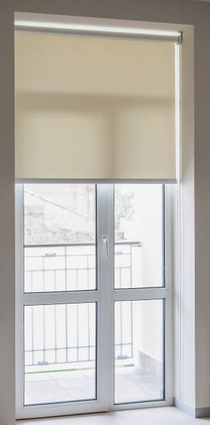 istock Modern balcony door with roller blind overlooking a cityscape on a bright day 2178365389