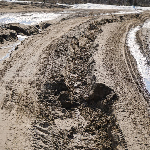 istock Car tracks on a dirty, damp road. Track from the car 2178367088