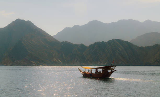 istock Traditional Boat Sailing in Scenic Mountain Landscape 2178367099