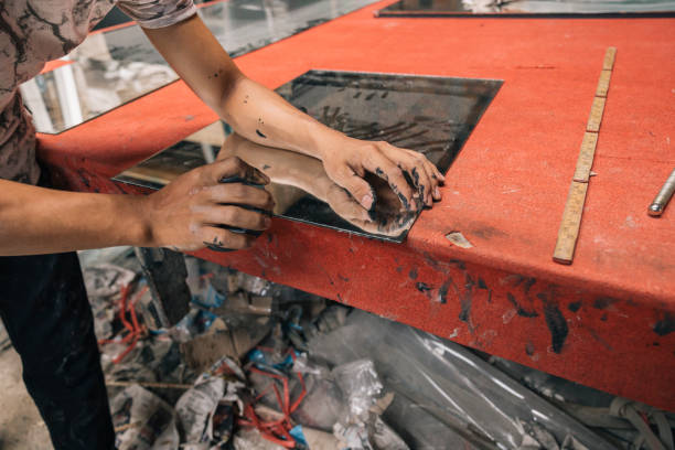 istock Hands of a worker handling a glass crystal 2178367556