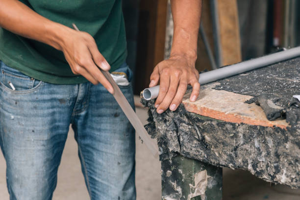 istock Hands of a person working with a pipe 2178368671
