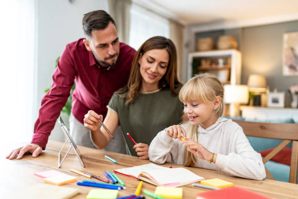 istock Young parents learning with daughter at home 2178368727