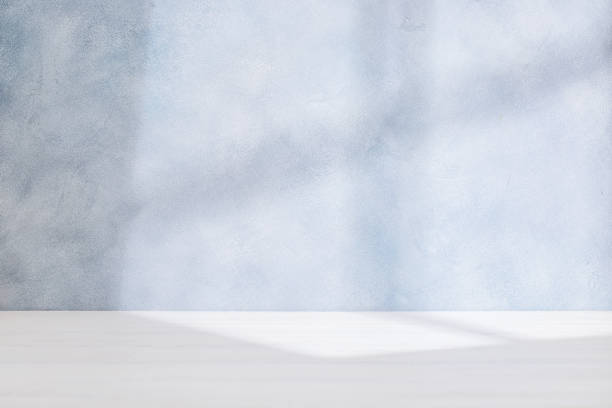 istock Wooden table and sunlit wall, product template 2178368799