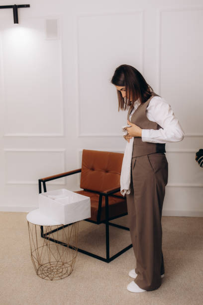 istock A female stylist puts clothes in an organiser 2178368897