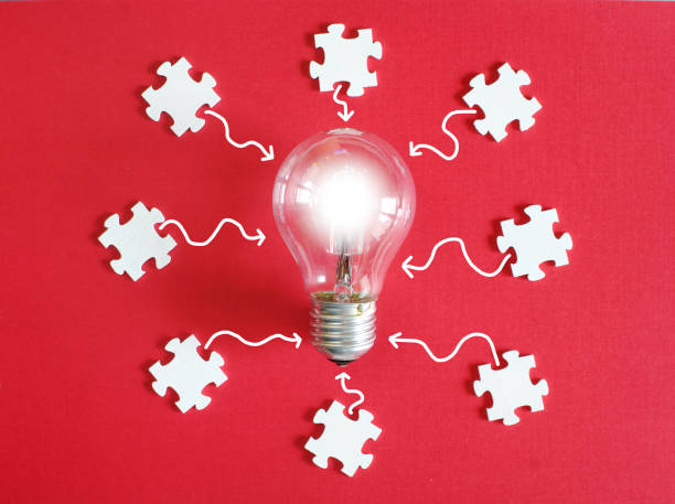 istock Business concept,collaboration,cooperation,teamwork, innovation,human resources,recruitment,team building with jigsaw puzzle pieces and lightbulb 2178374004