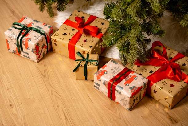 istock Festive Christmas Gifts Under Tree, Vintage Wrapping Paper Design 2178376631