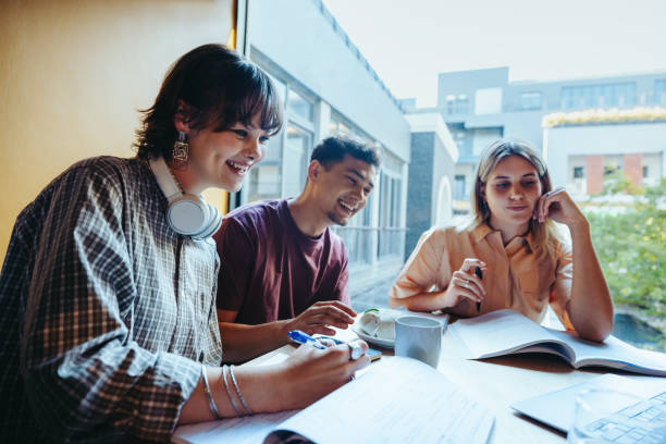 istock High school friends studying together on a city campus, collaborating and enjoying a group homework session 2178377032
