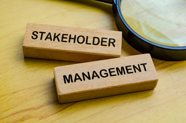 istock Stakeholder Management text on wooden blocks with magnifying glass background. Focus on stakeholder management concept 2178377055