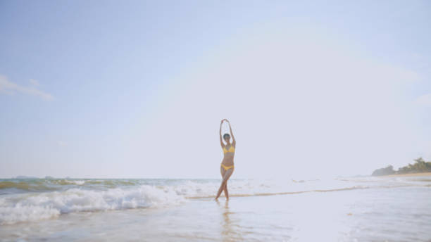 istock Beautiful Woman bikini relaxation on the Beach. 2178377192