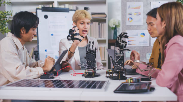 istock Team Engineers Meeting and analysis are conducting an experiment with robots. 2178377603
