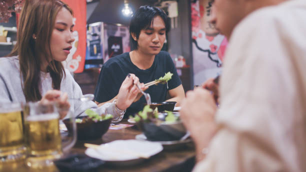 istock Group of friends in a Japanese restaurant. 2178377649