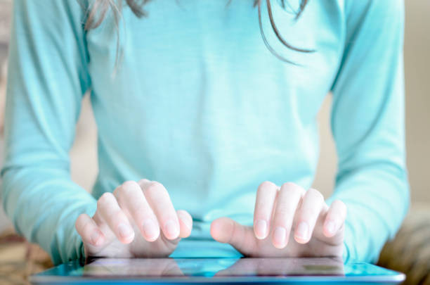School girl with digital tablet on white background