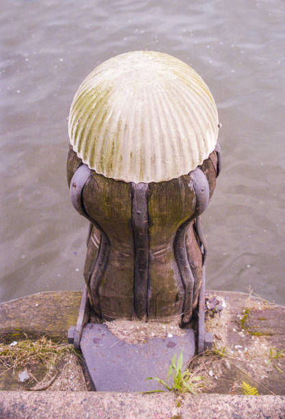 The original old historic mooring posts on the IJ river of Amsterdam that were replaced by bollards in 2010. Cultural heritage on the IJ river of Amsterdam; the original mooring posts. Cultural heritage on the IJ river of Amsterdam; the original mooring posts for shipping that stood on the quays along the water. Sumutrakade, Amsterdam