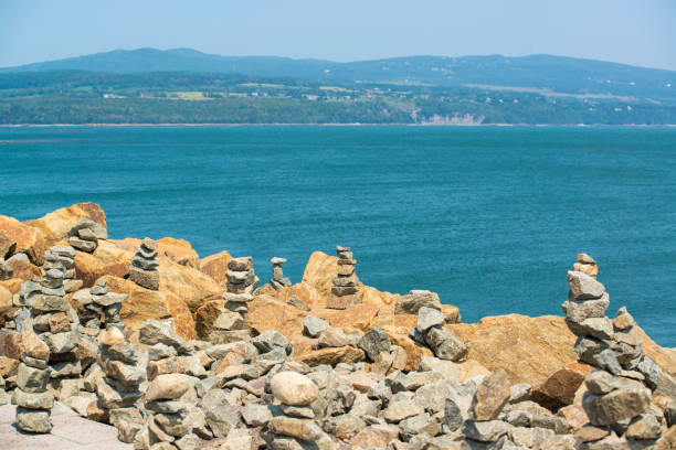 istock Prayer Stone Pile by the River St-Lawrence in La Malbaie Canada 2178385737