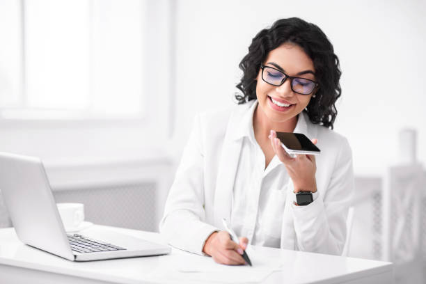 istock Happy hispanic woman using voice assistant on smartphone 2178386033