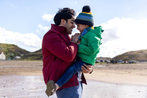 istock Lifted Up In Dads Arms 2178389543