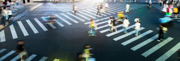 People are walking on the zebra crossing