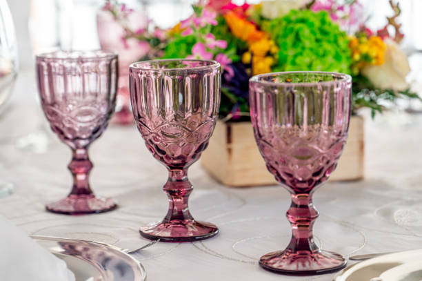 istock Celebration atmosphere with glasses, floral bouquets, chairs and a dining table 2178391214