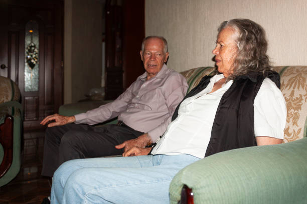istock Brother visits sister at home after pacemaker implant surgery to share and talk. 2178391733