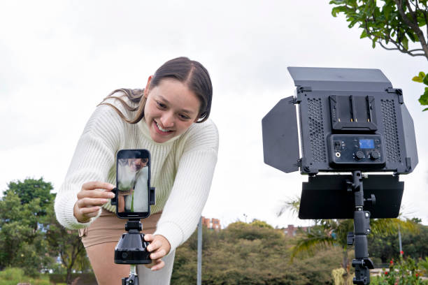 istock A young influencer with prosthetics broadcasts live from a park to create content for his social networks. 2178391849