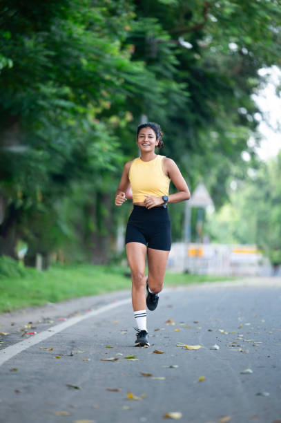 istock Young fit woman jogging in the park 2178393767